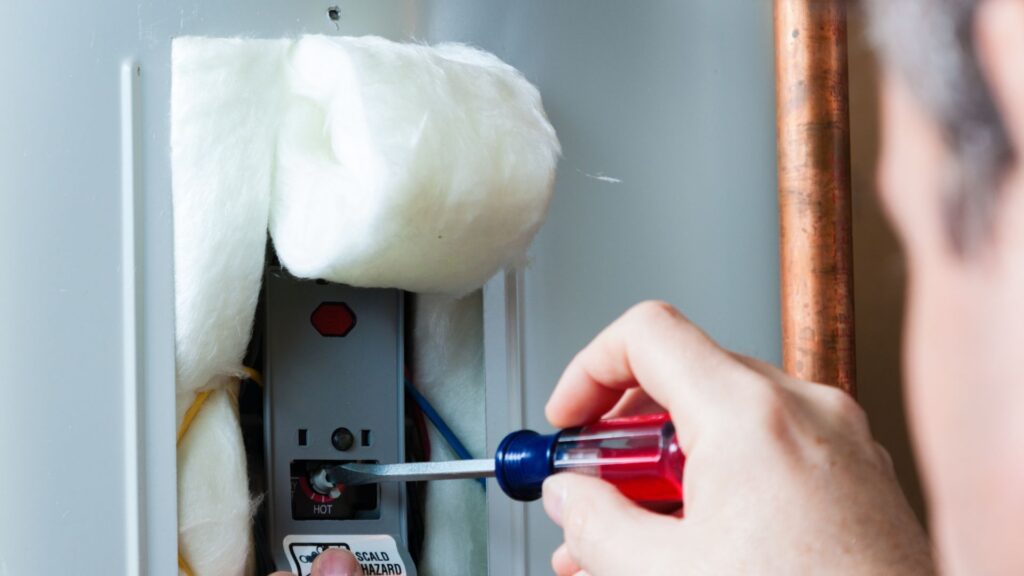 Affordable Water Heater Repair with screw driver